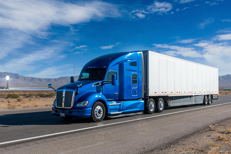 tractor trailer on open road
